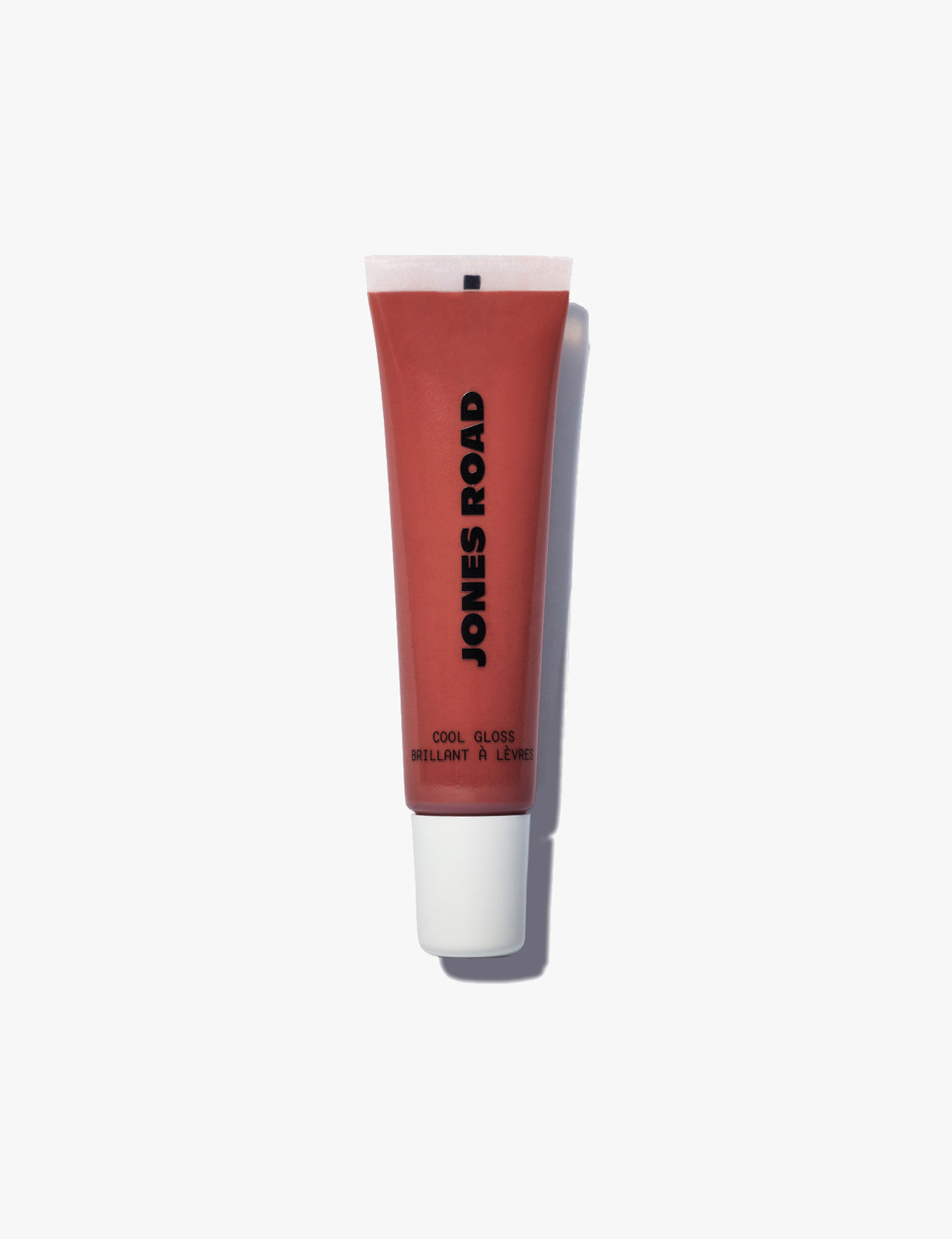 Jones Road tinted lip gloss tube in nude beige
