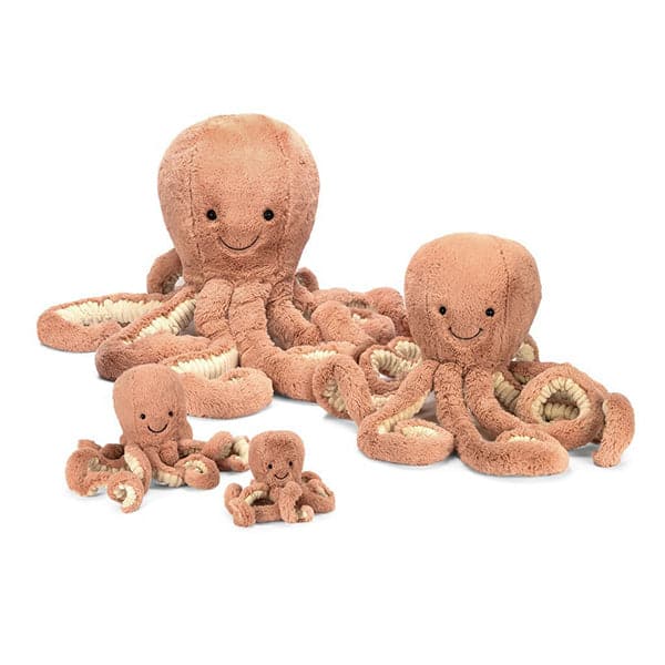 Four different sized pink octopus stuffed animal with a smiling face photographed on a cream background.