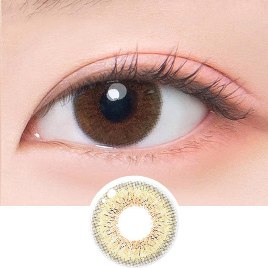 Macro shot of an eye wearing the DooNoon Juicy 1-Day Brown (10pk) prescription colour contact lens, showing the multi-colored detail and natural effect on dark brown eyes, with clean eye makeup. At the bottom is the pattern of the colored lens design, showing the dotted detail and pigmentation.