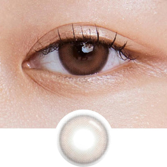 Macro photograph of a dark brown eye with clean makeup showcasing the Burnt Brown prescription color contact lens, highlighting the multicolored detail and natural effect