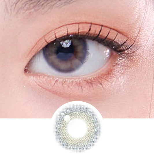 A close-up of a dark brown eye displaying the multicolored intricacy and opacity effect of the Marine Grey cosmetic contact lens.